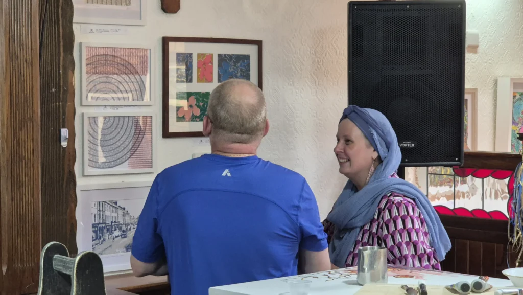 Two people look at art