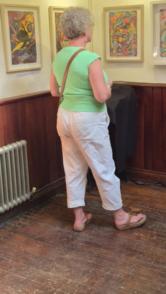 A woman looks at artwork