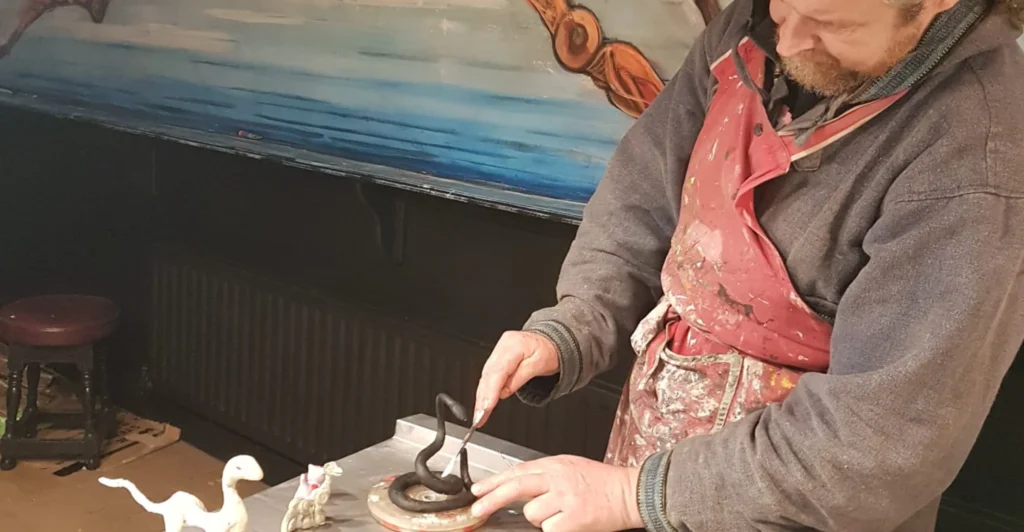 A man sculpting figures